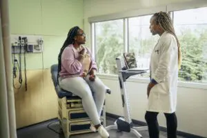 gi specialists with patient at clinic