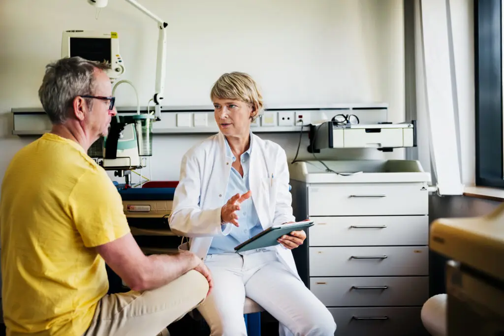 gastroenterologist talking with patient