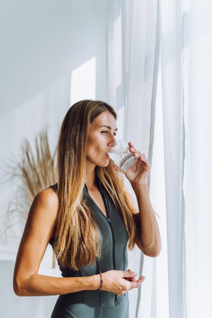 woman drinking water for constipation