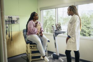 gi specialists with patient at clinic